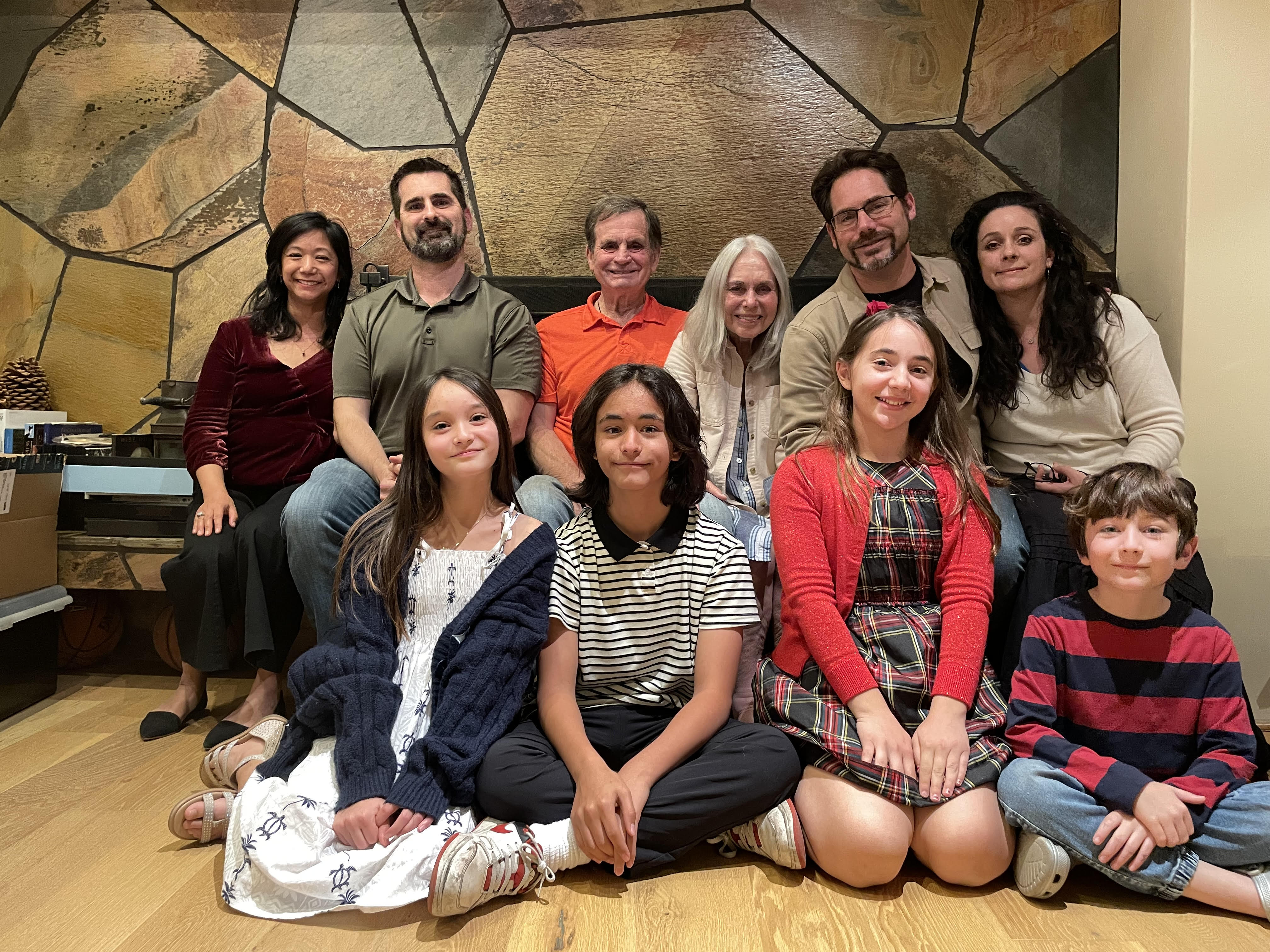 photo of a family seated in a living room for a group photo