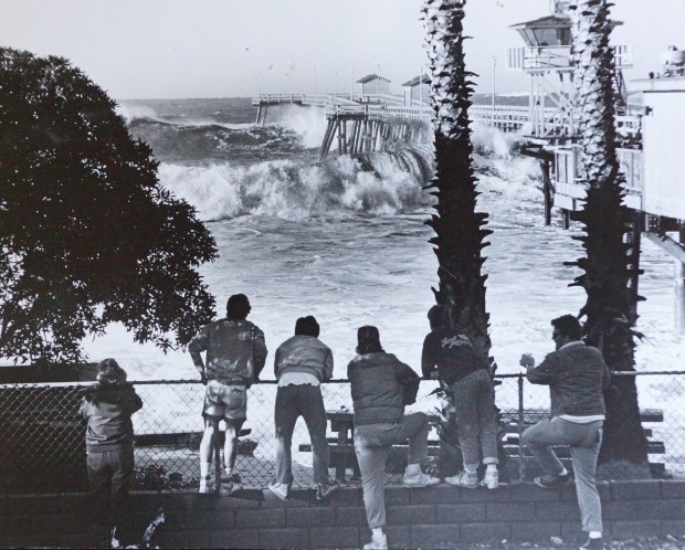 San Clemente redesigned and rebuilt its pier after El Niño storm surf knocked much of it down in1983. In another El Niño year, 1988, the pier took some major hits but survived. (Photo by FRED SWEGLES, ORANGE COUNTY REGISTER/SCNG)