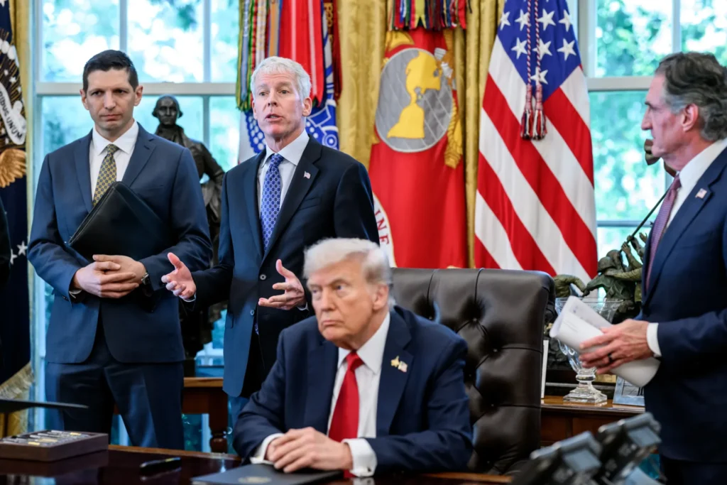 Chris Wright and Donald Trump, center