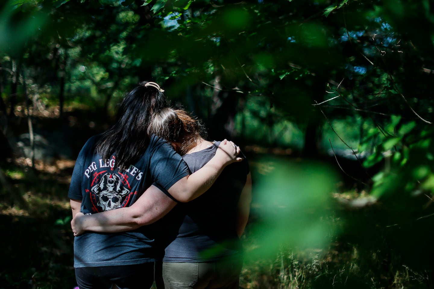 Lisa Thornton, right, embraces her daughter. Thornton and her daughter moved from Florida to Massachusetts in December to seek gender-affirming care after restrictions were imposed in their home state.