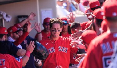 Boston Red Sox Roman Anthony is greeted in the dugout after scoring in the fourth inning of a spring training baseball game against the Minnesota Twins in Fort Myers, Fla., Wednesday, Feb. 25, 2026.
