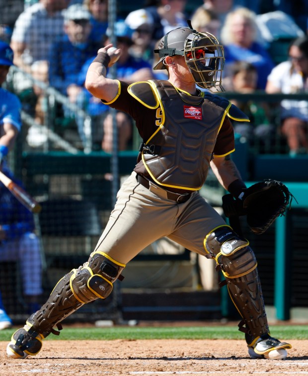 Surprise, AZ - February 21: Freddy Fermin #54 of the San Diego Padres warms up in between innings during a spring training game against the Kansas City Royals on February 21, 2026 in Surprise, AZ.  (K.C. Alfred / The San Diego Union-Tribune)