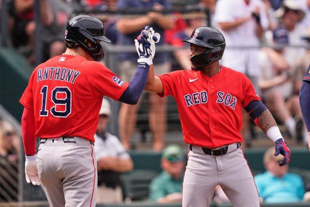 Boston Red Sox Ceddanne Rafaela celebrates is two run home run with Roman Anthony in the third inning of a spring training baseball game against the Atlanta Braves in North Port, Fla., Friday, Feb. 27, 2026. (AP Photo/Gerald Herbert)