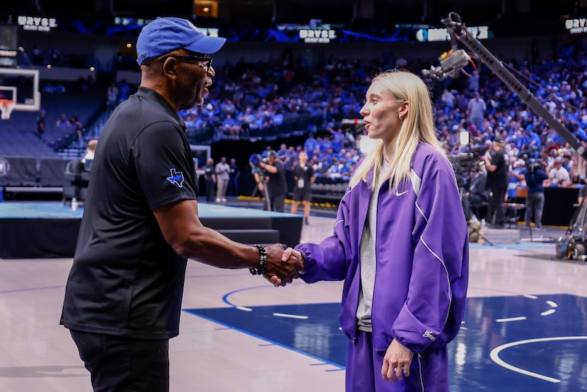 Dallas Mavericks 1981 No. 1 overall pick Mark Aguirre (left) shakes hands with Dallas Wings...