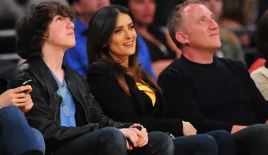 Salma Hayek, 59, scorches in orange bikini and body chain for SI Swim image