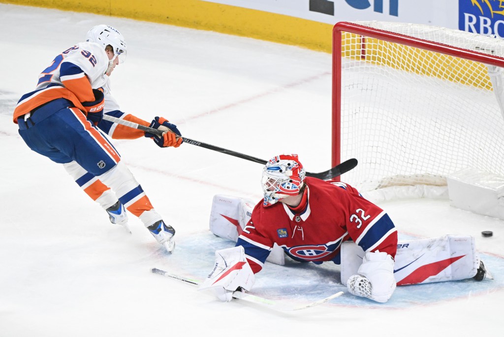 Simon Holmstrom scores on Jacob Fowler during the first period of the Islanders' road blowout loss to the Canadiens.