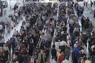 Travelers line up at a TSA checkpoint at George Bush Intercontinental Airport in Houston on...