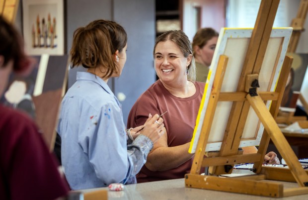 ArtQuest visual arts teacher Brooke Delello, right, works with junior Talia Loarie on her self-portrait project Tuesday, March 10, 2026 at Santa Rosa High School. (John Burgess/The Press Democrat)
