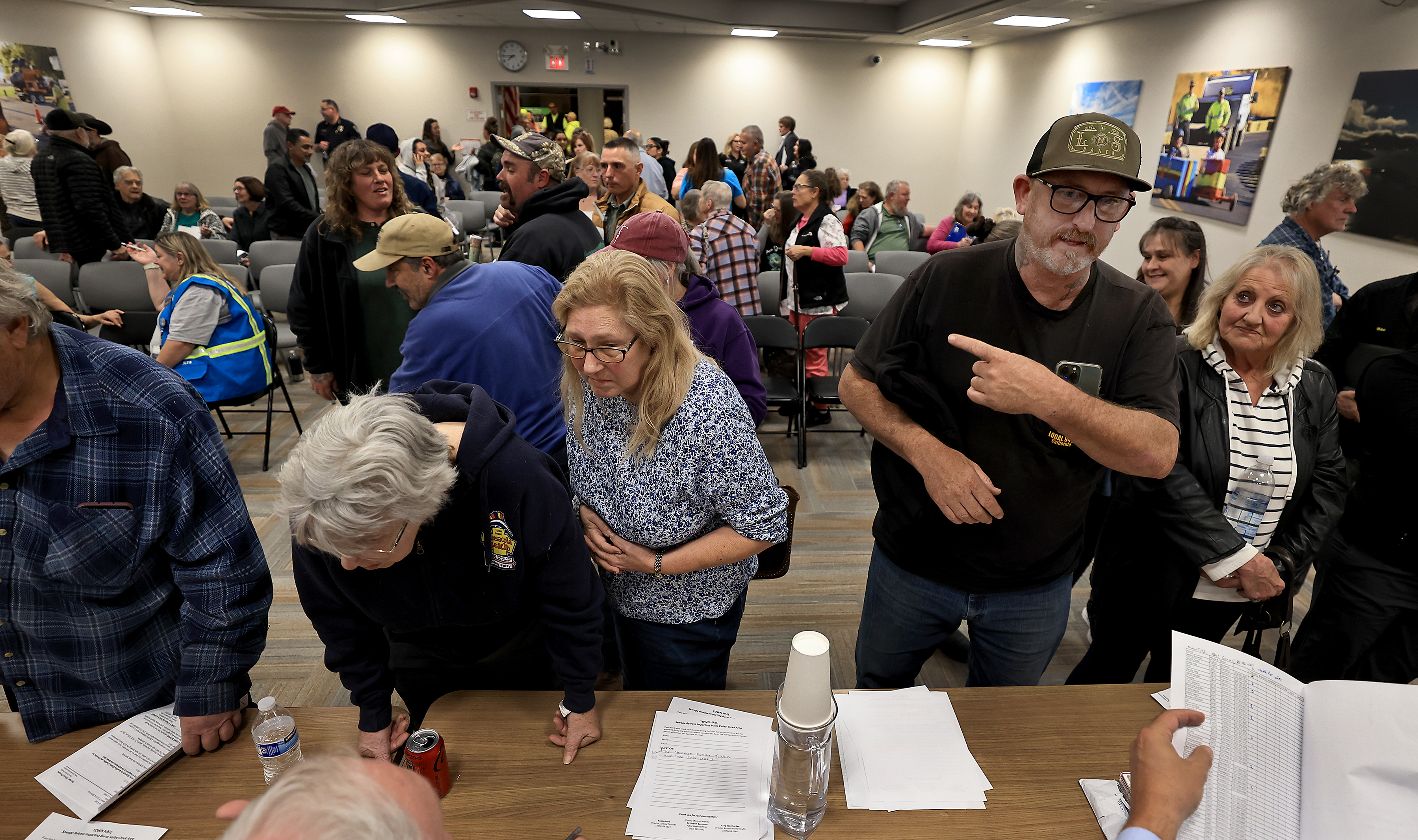 After a town hall meeting, Clearlake residents, from left, Barbara...