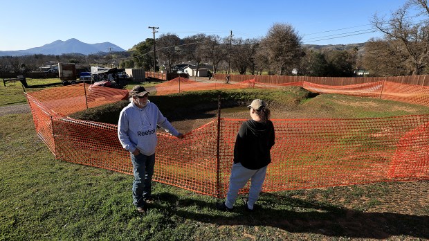 Steve George and friend Lindsay Heape, both in the Clearlake sewage spill zone, discuss the ongoing water issues, Wednesday, Feb. 4, 2026. (Kent Porter / The Press Democrat)