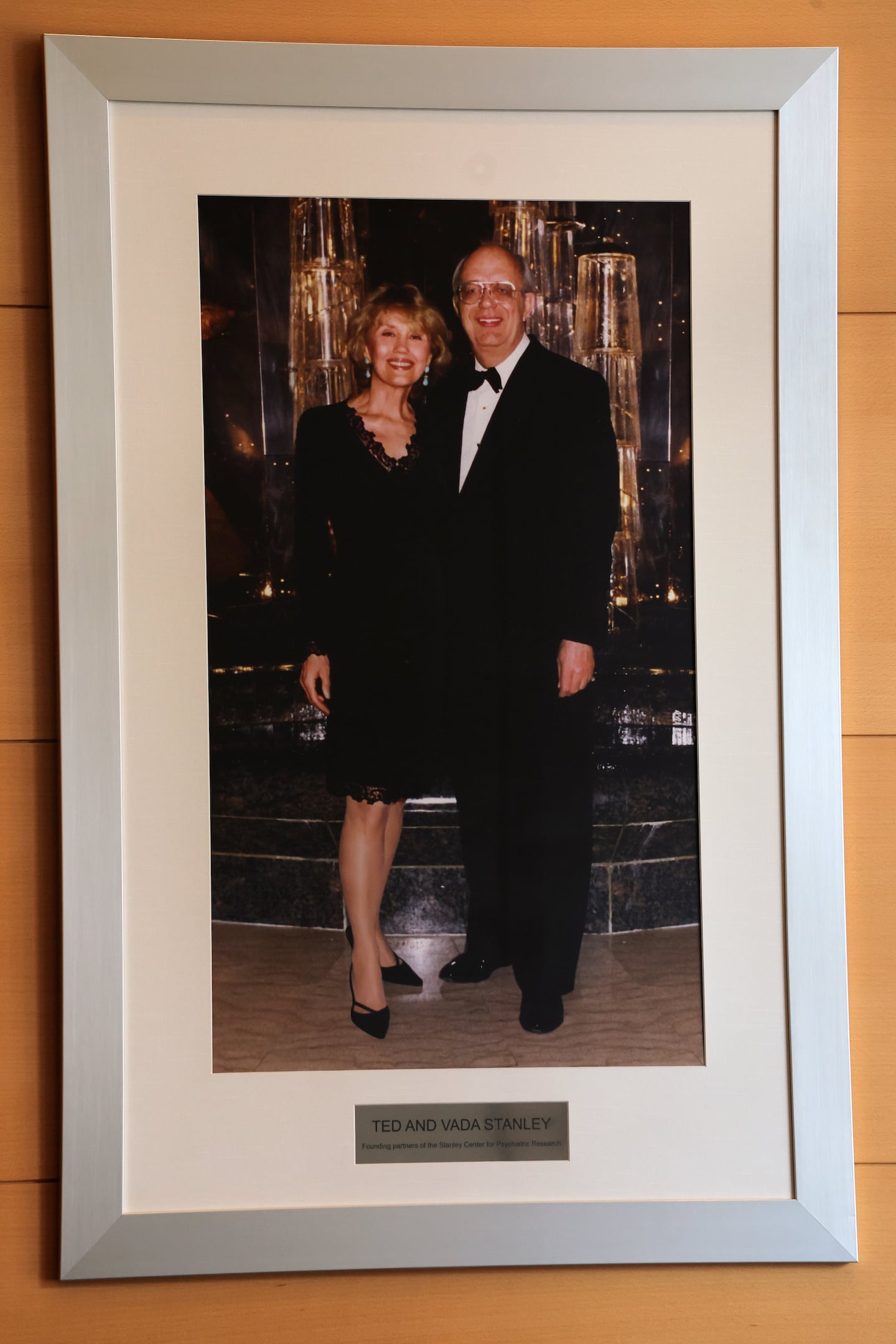 A portrait of Ted and Vada Stanley hangs in the lobby of the Stanley Center for Psychiatric Research in Cambridge on March 17.