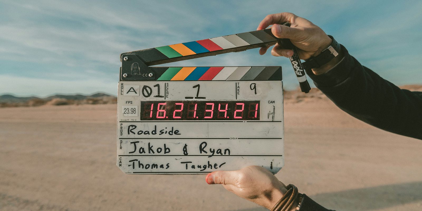 This shortcut finds all your long videos to safeguard your iPhone storage | Photo shows a digital movie clapboard in a desert