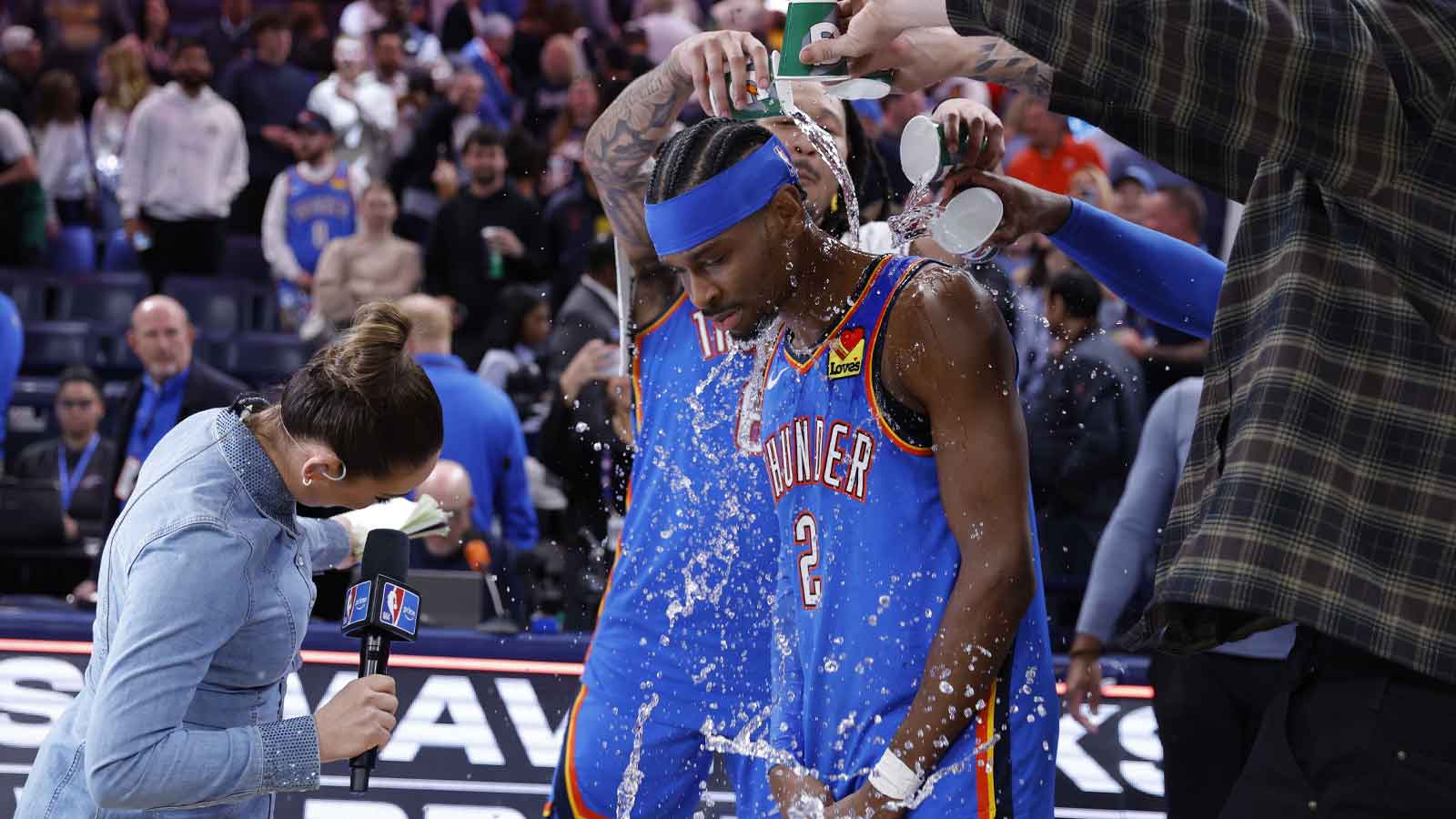 Thunder guard Shai Gilgeous-Alexander’s teammate pour water on him at the end of a game against the Boston Celtics during the fourth quarter at Paycom Center