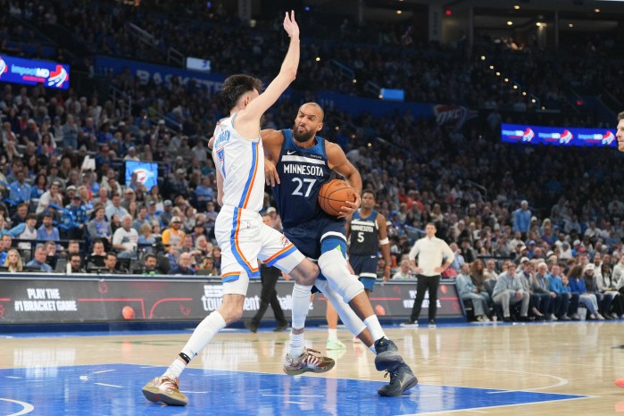 Rudy Gobert drives past Chet Holmgren