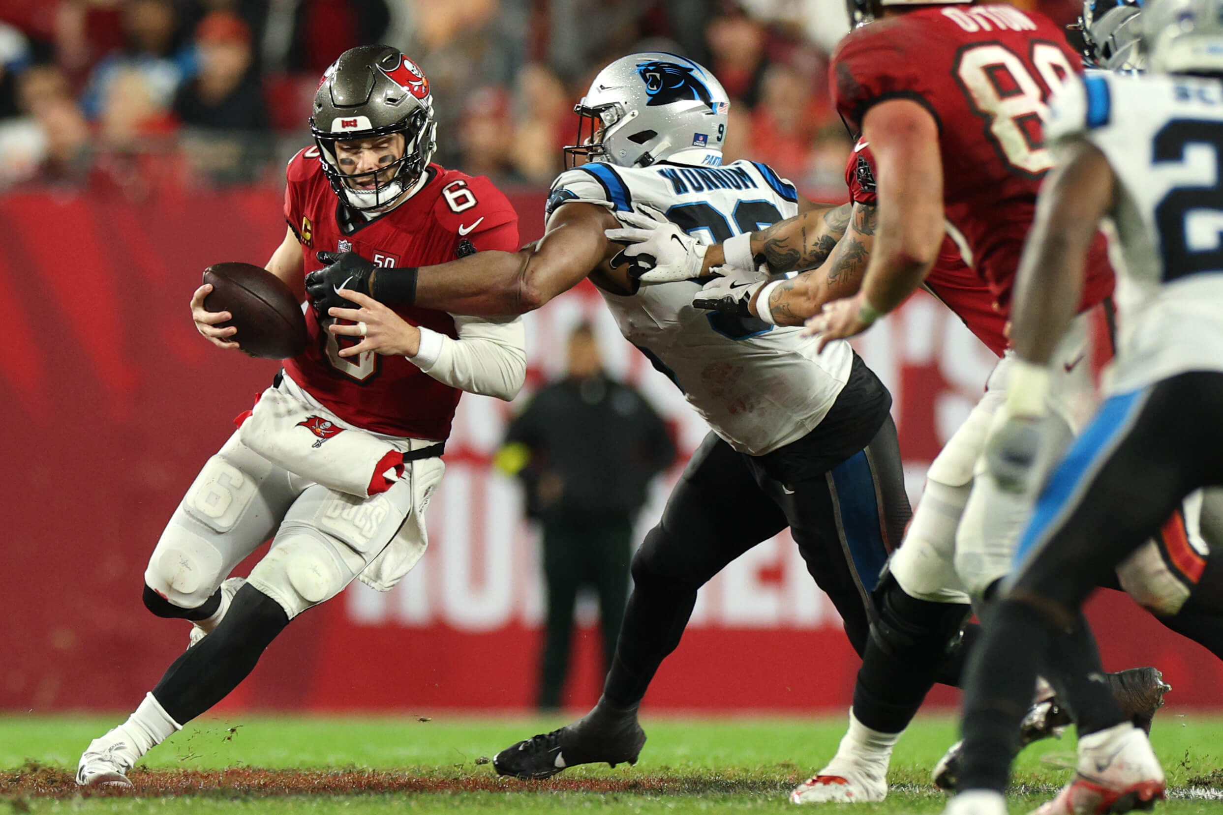 Tampa Bay Buccaneers quarterback Baker Mayfield (6) runs against Carolina Panthers linebacker D.J. Wonnum (98) in the second half at Raymond James Stadium. 