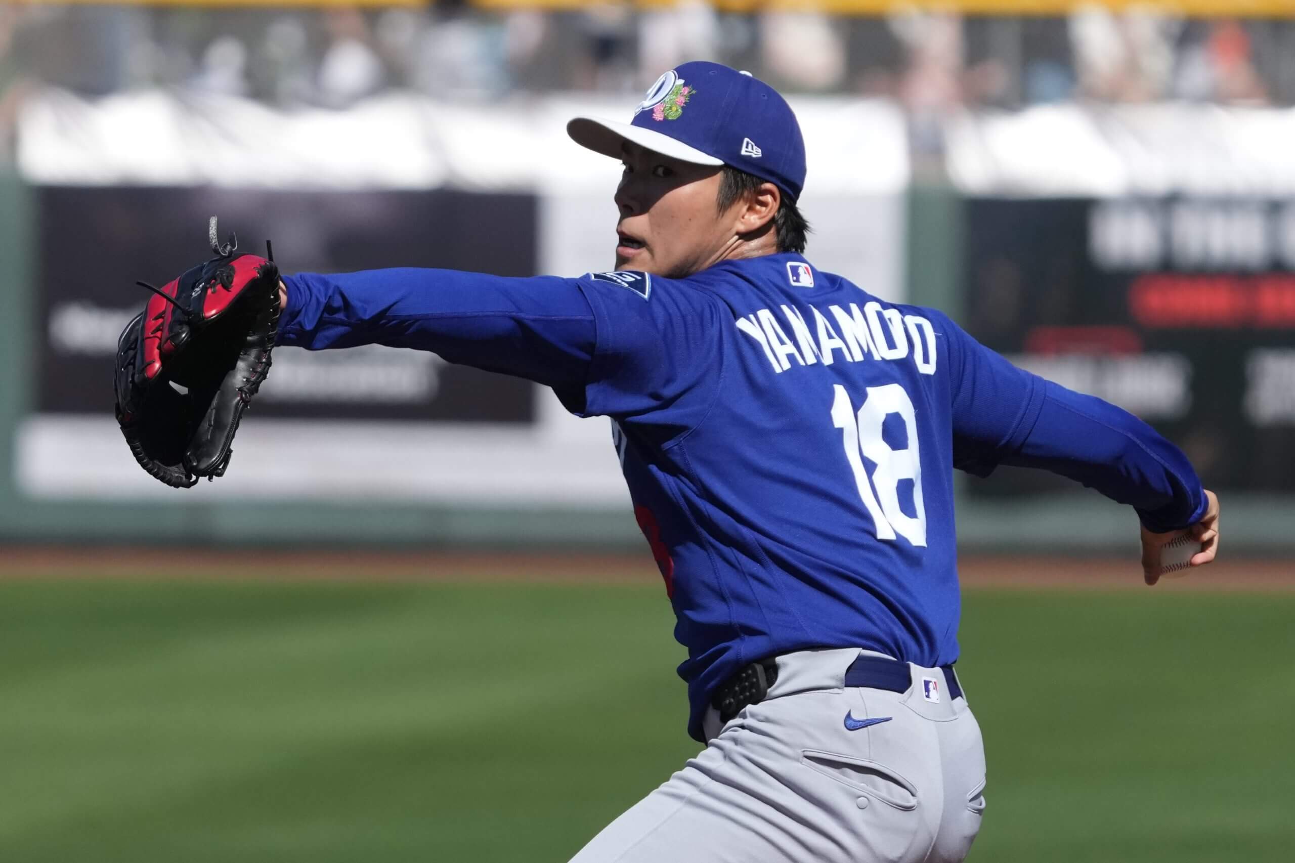 Los Angeles Dodgers pitcher Yoshinobu Yamamoto rears back to throw against the San Francisco Giants in a Cactus League game Feb. 27, 2026.