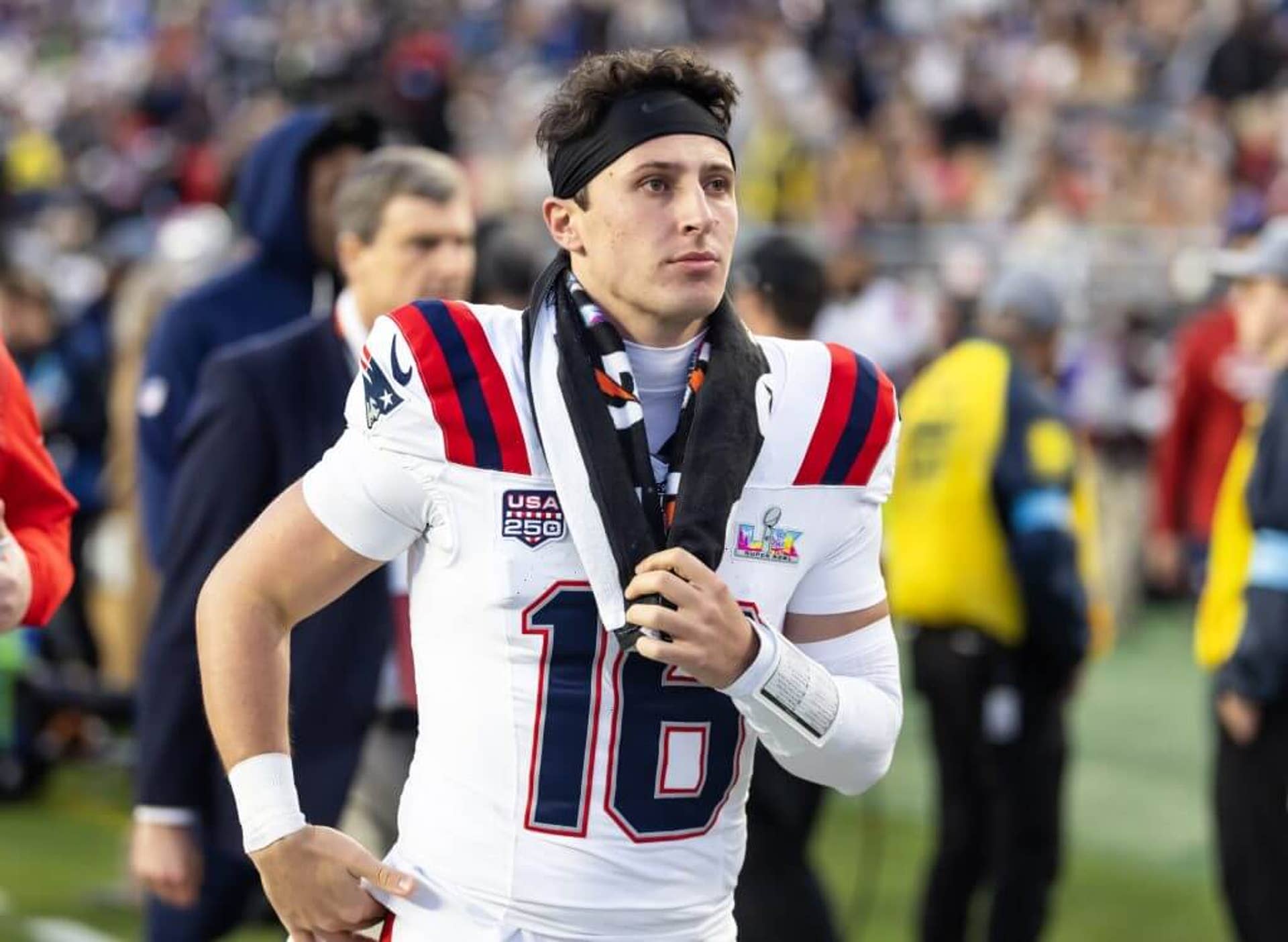 Patriots quarterback Tommy DeVito (16) runs along the sideline during Super Bowl 60 against the Seattle Seahawks.