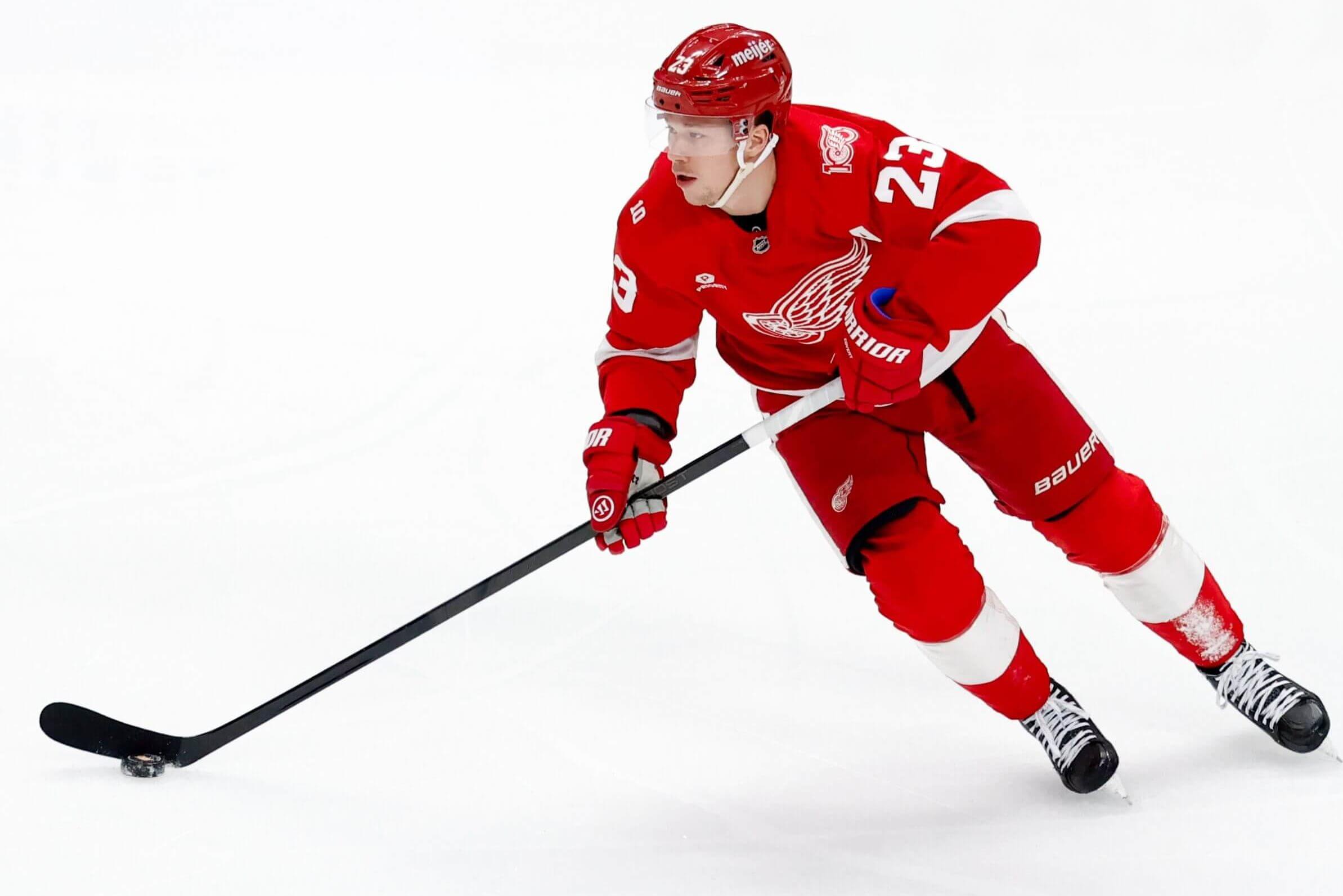 The Red Wings' Lucas Raymond skates with the puck