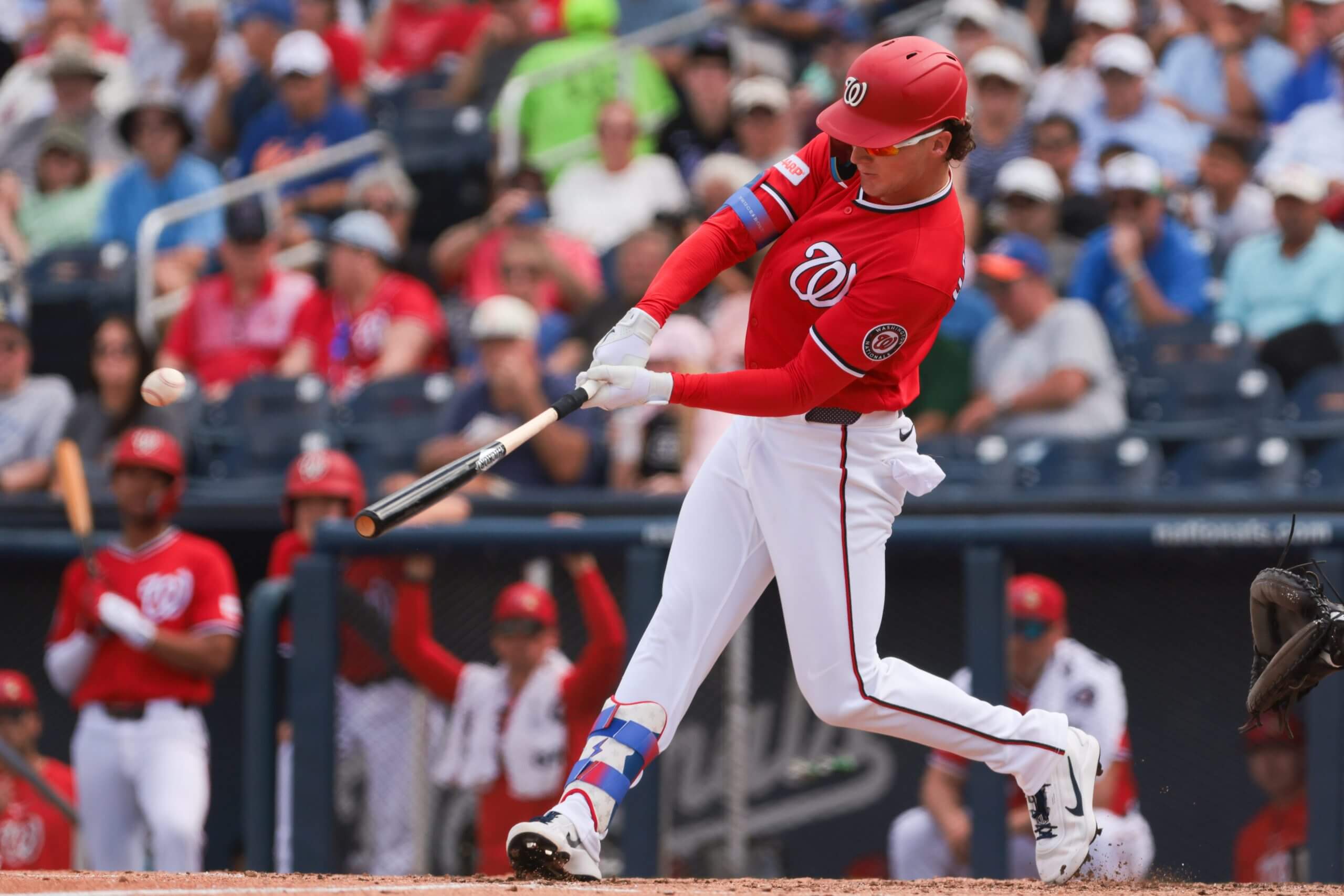 Robert Hassell III hits a single against the Mets during a spring training game.