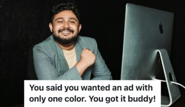 Man smiling while at computer