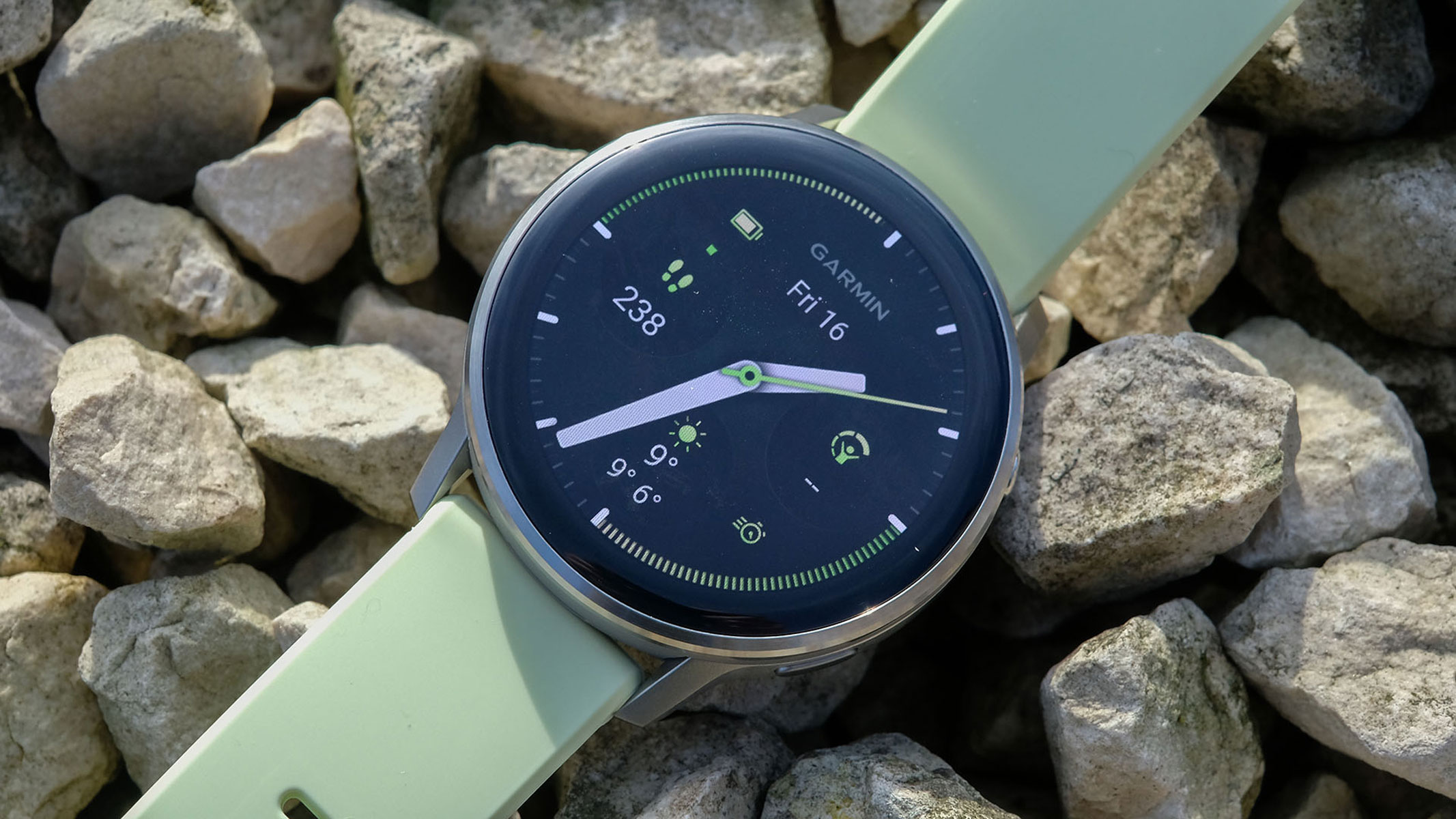 a close-up picture of the Garmin Venu 4 smartwatch laid flat on the ground