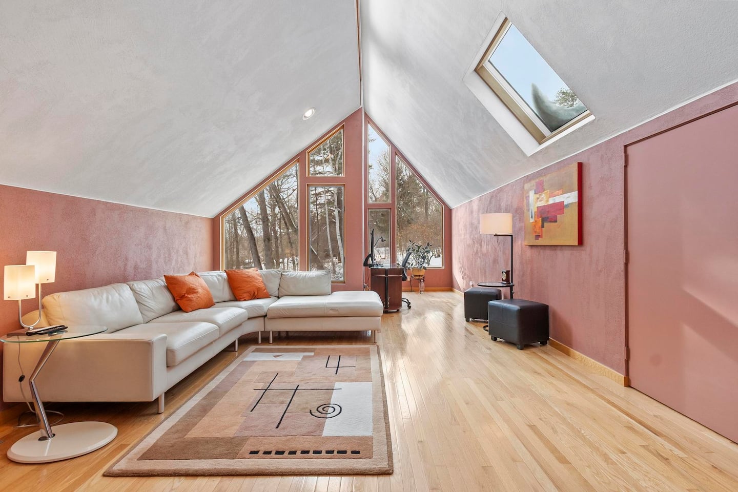 The family room is on the lower level, but still has vaulted ceilings and a skylight.