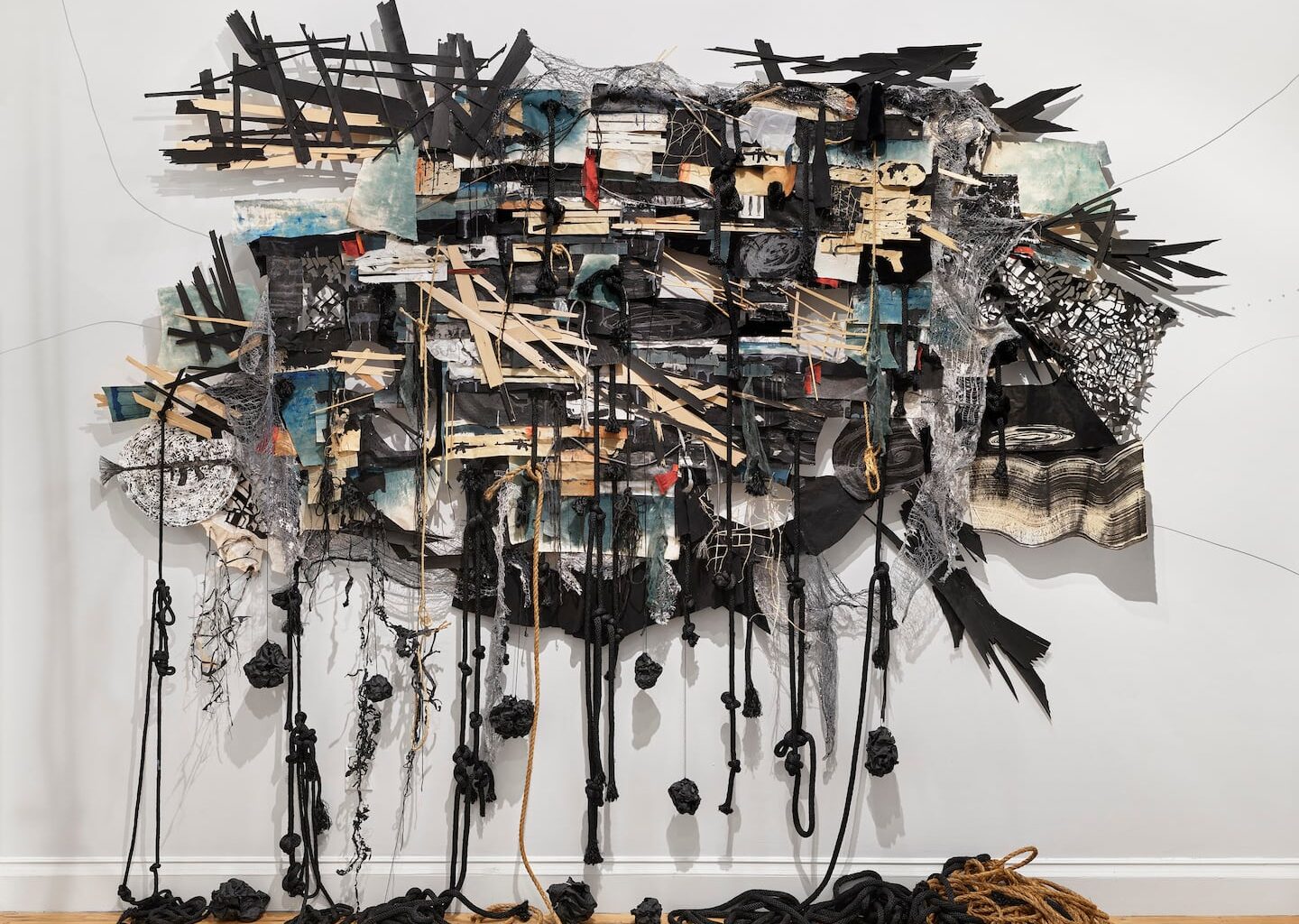 Heidi Whitman, "Ahab’s Head: American Vengeance" (detail, the destruction of the Pequod), 2020-2025. Ink, gouache, acrylic, paper, canvas, cloth, string, rope, wood, Cinefoil, sound, and cast shadows. Dimensions variable.