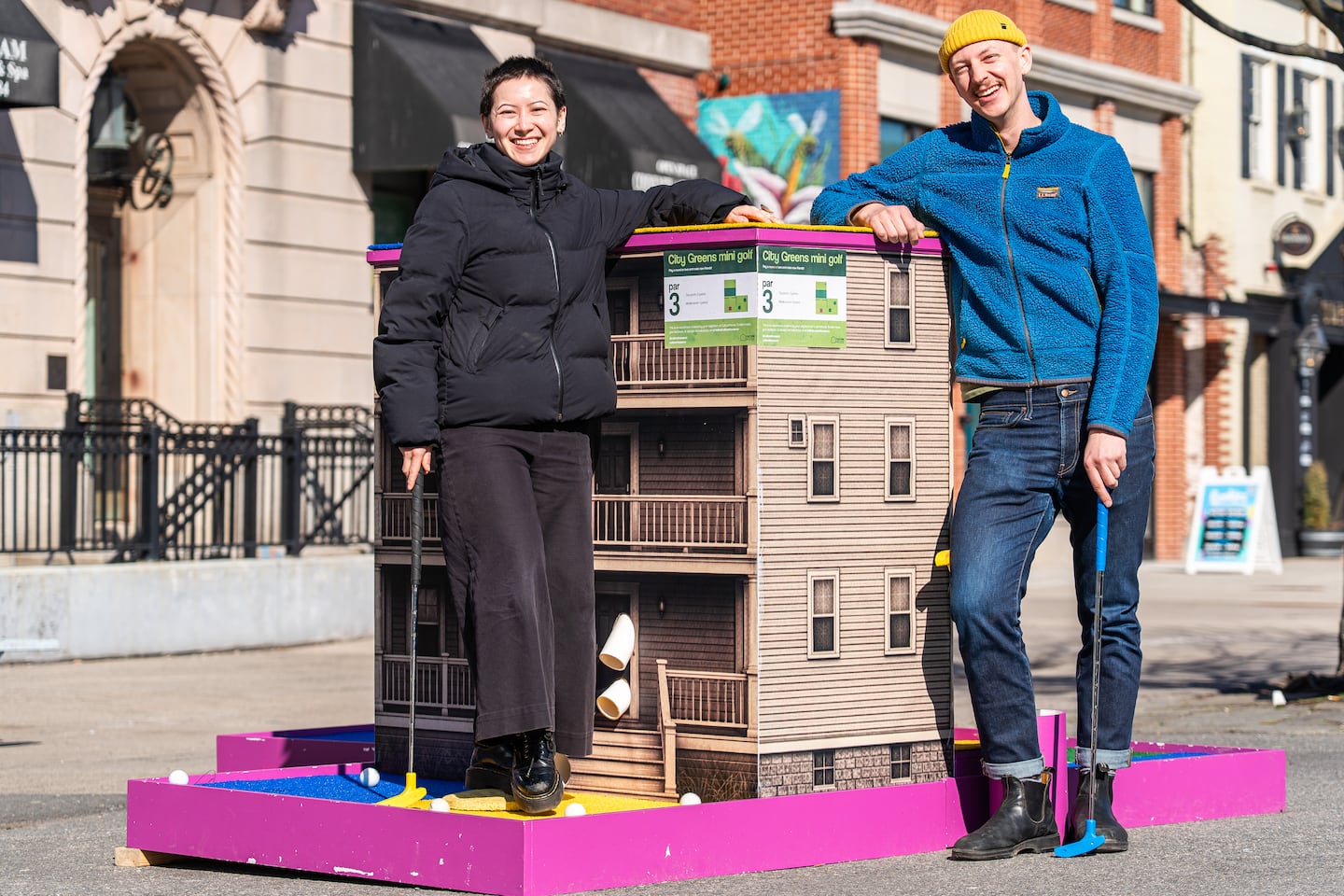 Culture House Operations Manager Phoebe Wong and Executive Director Aaron Greiner with their pop-up mini-golf hole in Union Square, which they hope is the first of many.