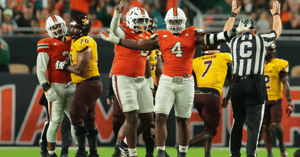 Sep 6, 2025; Miami Gardens, Florida, USA; Miami Hurricanes defensive lineman Rueben Bain Jr. (4) reacts after a sack against the Bethune-Cookman Wildcats during the third quarter at Hard Rock Stadium. Mandatory Credit: Sam Navarro-Imagn Images