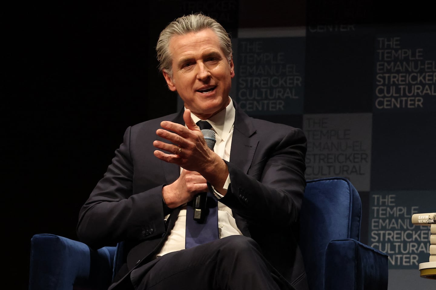 California Governor Gavin Newsom spoje with Harry Sisson to promote his book, "Young Man in a Hurry" at the Streicker Cultural Center, in New York, on Feb. 24.