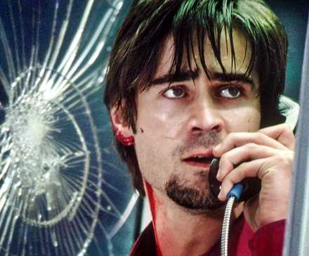 A bloodied Colin Farrell holds a phone in Phone Booth