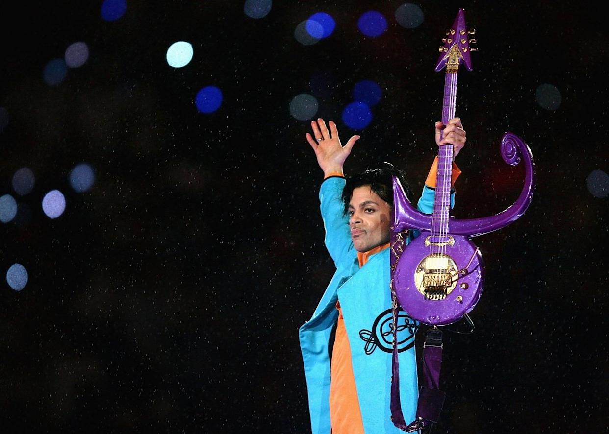 Prince performs during the Super Bowl XLI halftime show sponsored by Pepsi. - 