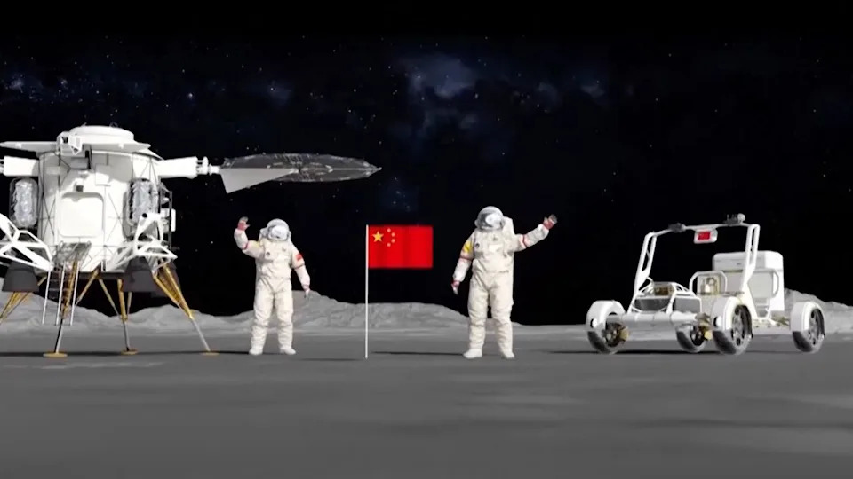 Two astronauts in white spacesuits stand on either side of a red flag, standing in the center on the moon's surface. On the left, a moon lander with two circular solar panels. On the right, a moon rover.
