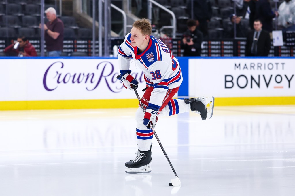 New York Rangers player Adam Sykora #38 skates his rookie lap on the ice.