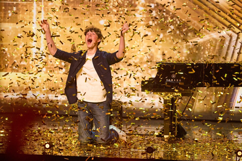 rafferty coope celebrates on stage after receiving a golden buzzer on britains got talent 2026