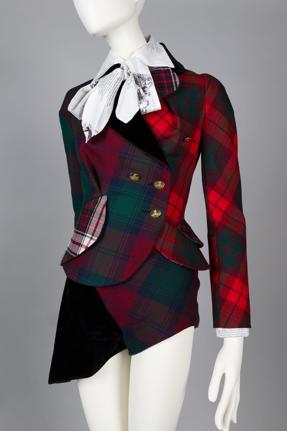 fashion garment featuring a plaid blazer and shorts combination fashion garment featuring a plaid blazer and shorts combination
