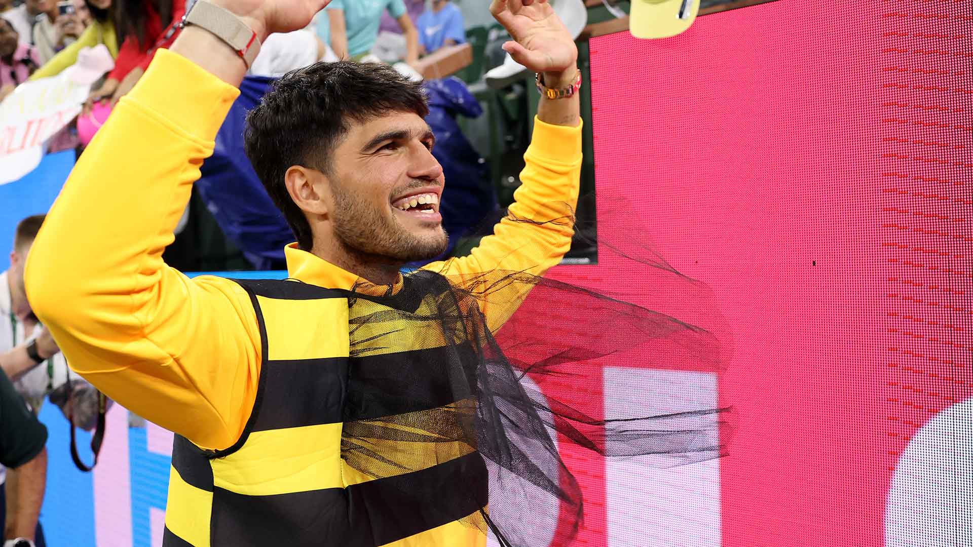 Carlos Alcaraz wears a bee costume following his Indian Wells quarter-final win against Cameron Norrie.