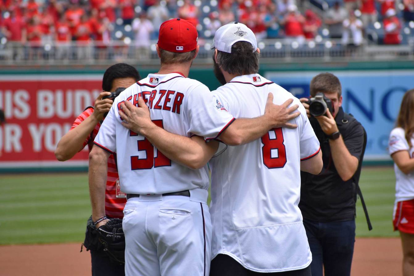 Alex Ovechkin poses for a photo with Max Scherzer after throwing a ceremonial first pitch at a June 9, 2018 Washington Nationals game