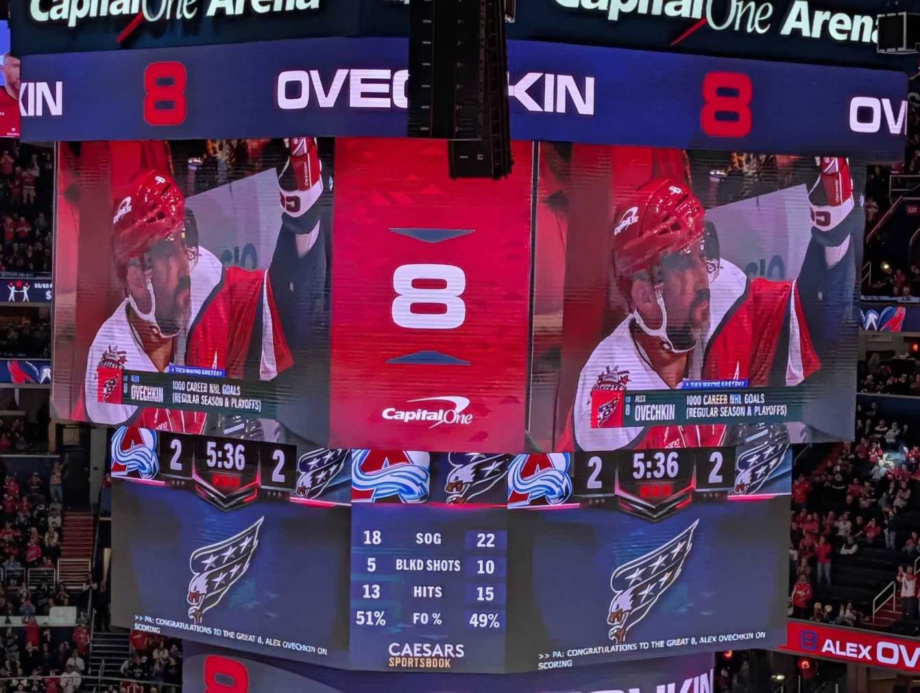 Alex Ovechkin waves from the bench after scoring his 1,000th career goal regular season and playoffs combined