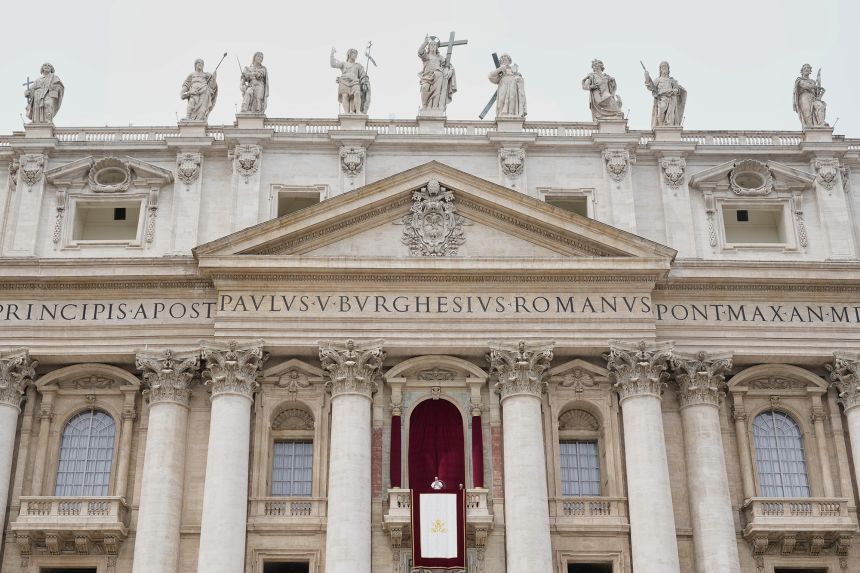 Pope Leo XIV appears at the central balcony of St. Peter's Basilica for his first Sunday blessing after his election, in St. Peter's Square at the Vatican, on May 11, 2025.