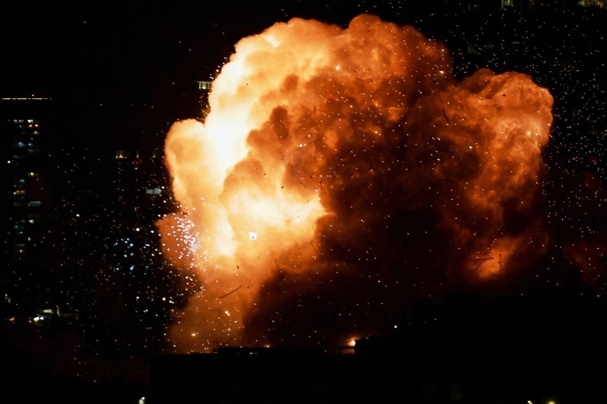 An explosion lights up the night sky as a missile hits a building in Tel Aviv on February 28.