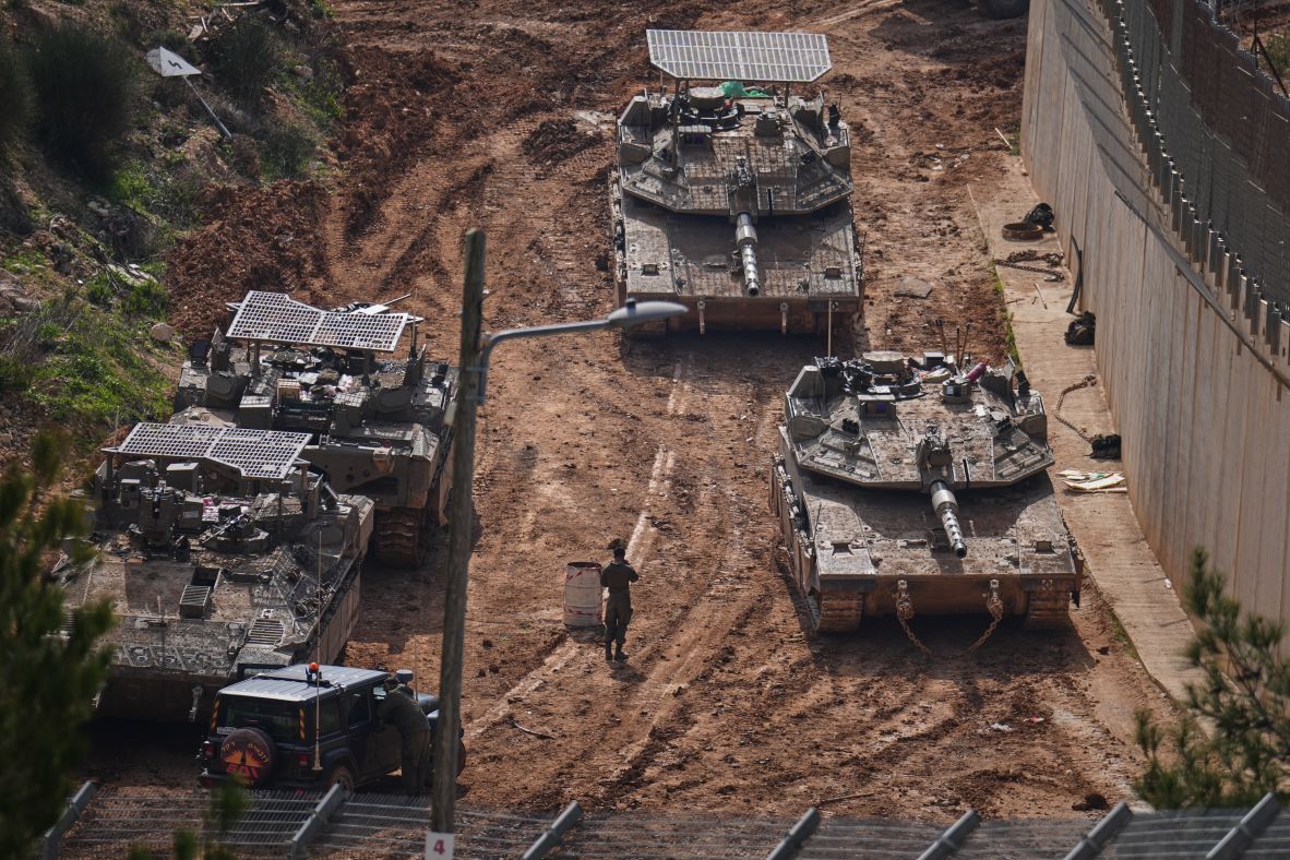 Israeli tanks maneuver near the Israel-Lebanon border on Wednesday.