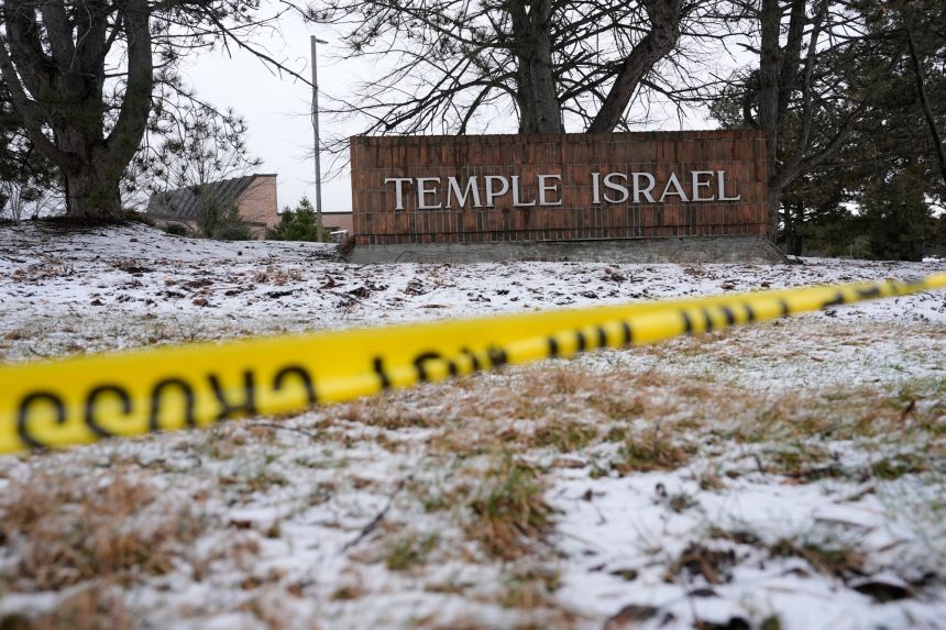 Police tape hangs outside the Temple Israel synagogue on Friday in West Bloomfield Township, Michigan.