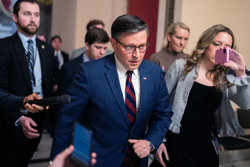 Speaker of the House Mike Johnson talks with reporters in the US Capitol on Thursday.
