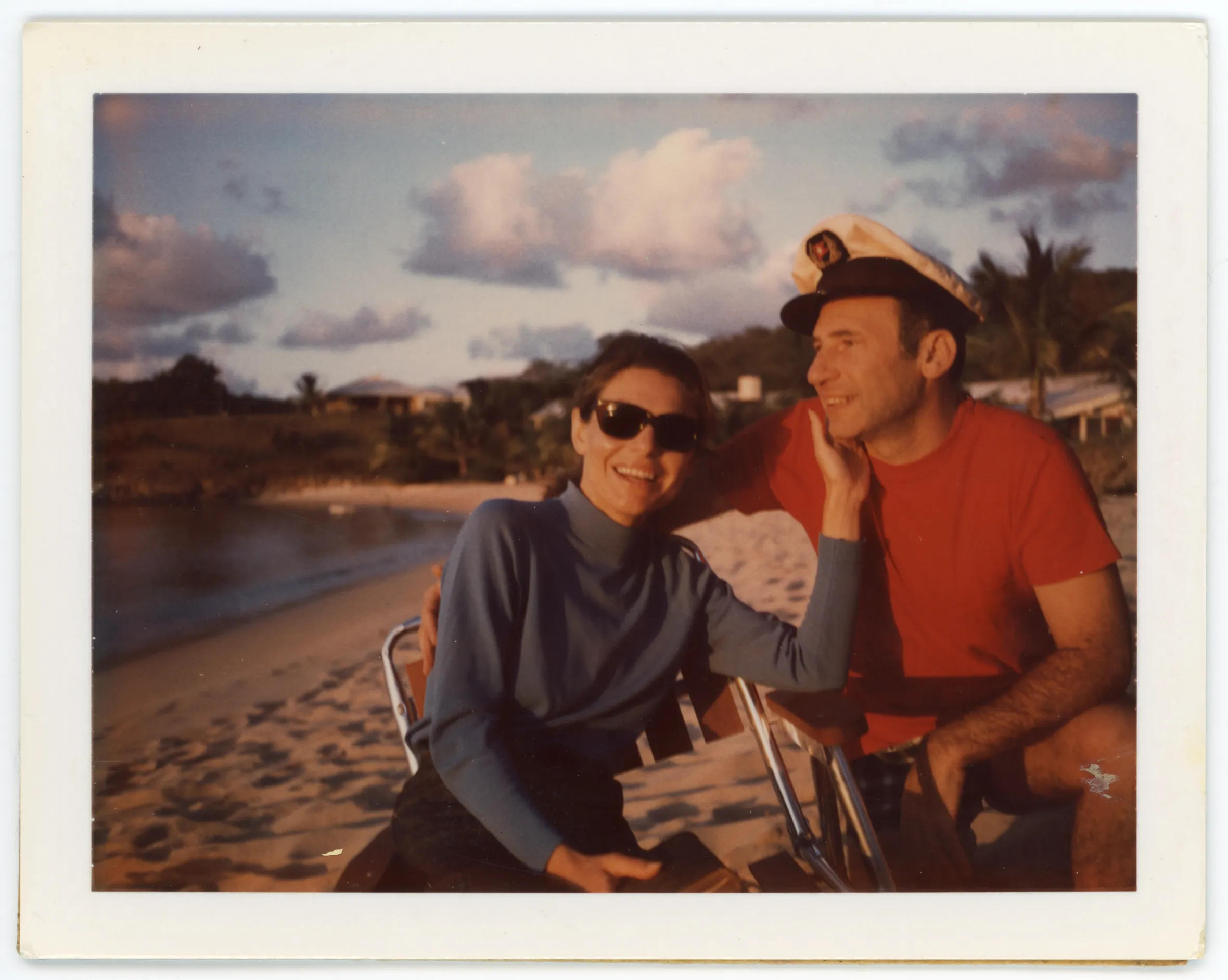Mel Brooks and Anne Bancroft relaxing on a beach.
