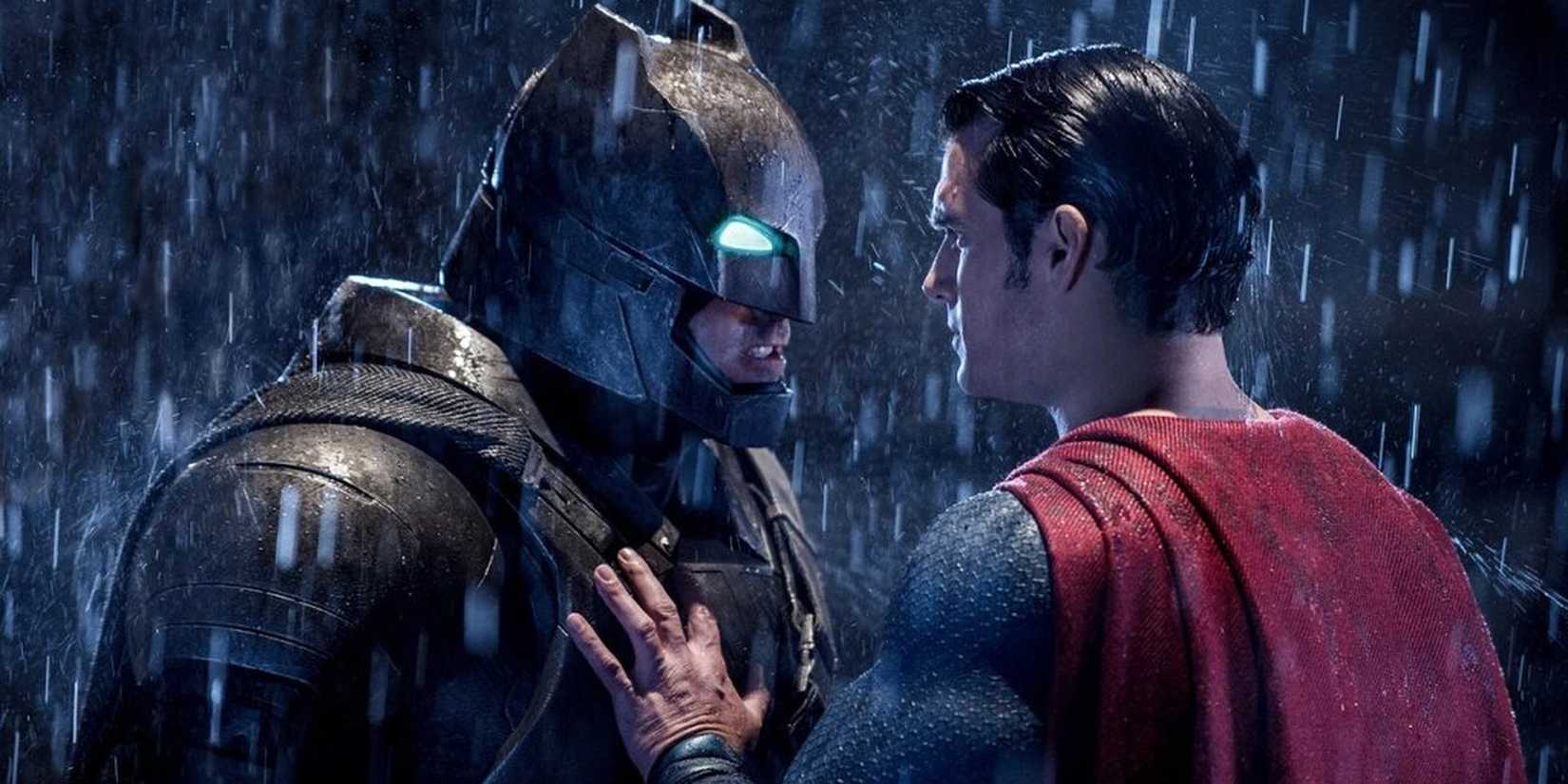 Armored Batman confronting Superman in the rain in Batman v Superman.