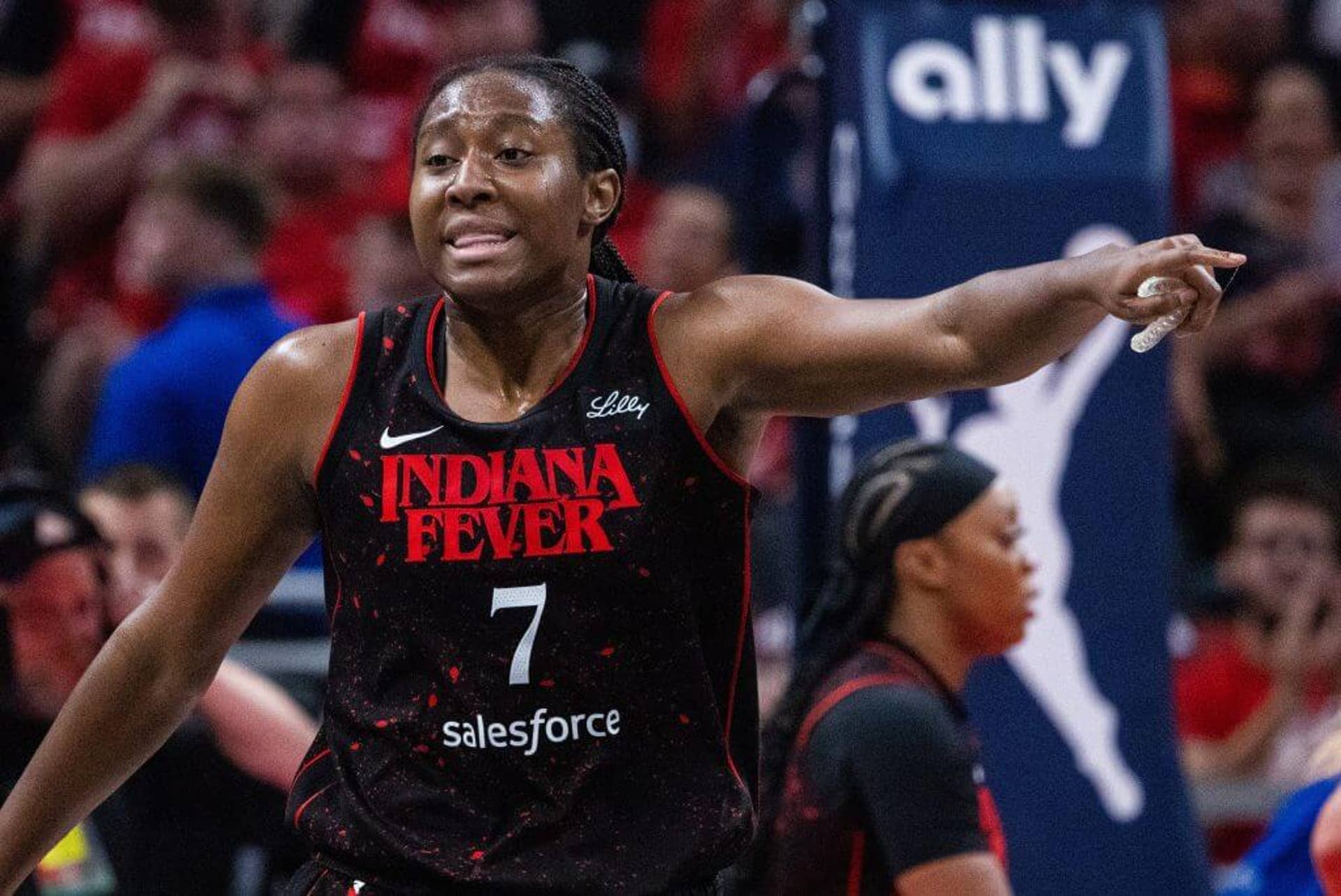 Indiana Fever forward Aliyah Boston gestures during a 2025 playoff game against the Las Vegas Aces at Gainbridge Fieldhouse.