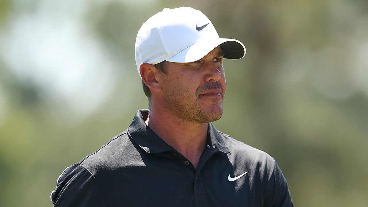 Brooks Koepka looks on course