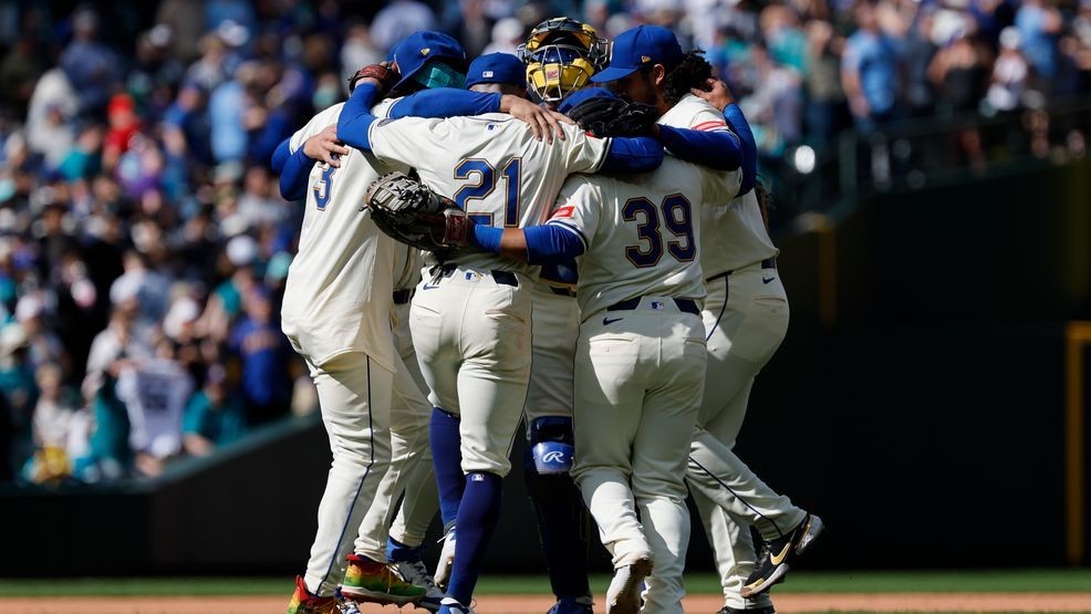 J.P. Crawford #3, Miles Mastrobuoni #21, Donovan Solano #39 and Andrés Muñoz #75 of the Seattle Mariners dance with teammates after the game against the Texas Rangers at T-Mobile Park on April 13, 2025 in Seattle, Washington. The Seattle Mariners won 3-1. (Photo by Alika Jenner/Getty Images)