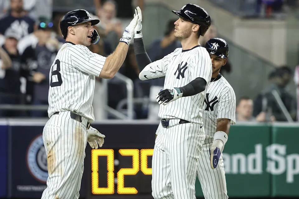 May 18, 2025; Bronx, New York, USA; New York Yankees left fielder Cody Bellinger (35) is greeted by first baseman Paul Goldschmidt (48) after hitting a grand slam home run in the eighth inning against the New York Mets at Yankee Stadium. Mandatory Credit: Wendell Cruz-Imagn Images